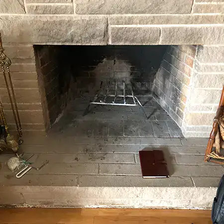 Open masonry fireplace ready for an insert